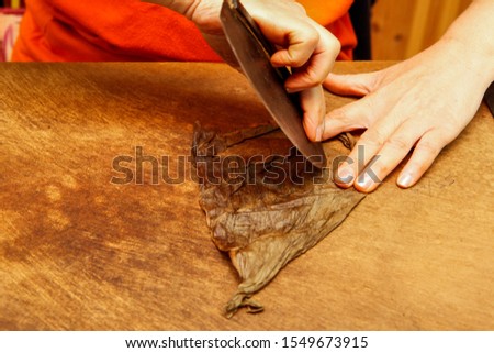 Cigar manufacturing in small scale with traditional tools in Greece Royalty-Free Stock Photo #1549673915