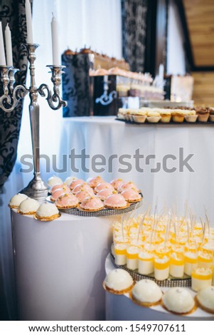 Wedding decorated dessert table in a restaurant