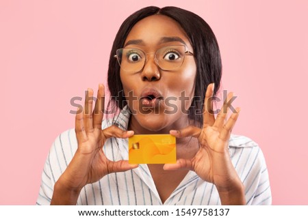 Banking Services. Funny African American Woman Showing Credit Card Standing On Pink Background. Studio Shot