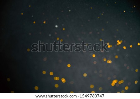 blurred golden bokeh on a black background 