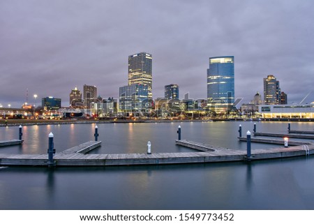 Nighttime skyline of Milwaukee, Wisconsin from the shores of Lake Michigan and the marina at Lakeshore State Park.