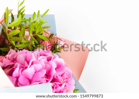 pink flower bouquet on a white background. in gift wrapping. Place for an inscription. Easy to cut. View from above. close-up.