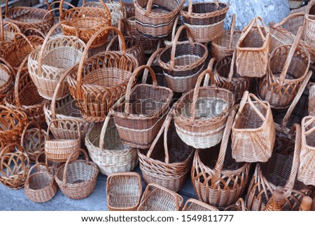 Lots of wicker baskets. Street sale of baskets for mushroom pickers.