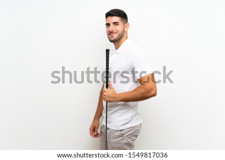 Handsome young golfer player man over isolated white background
