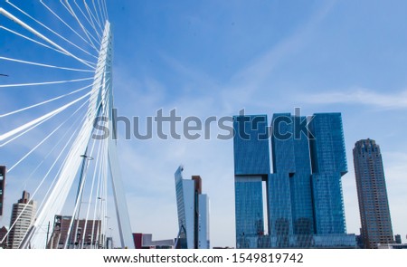 Rotterdam landmark Erasmus Bridge and the three buildings with classic skyline. Urban city view concept. 