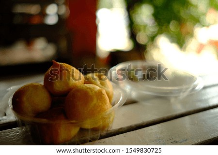 Pictures of pastries named is Choux Cream . In a container placed on the table ready to eat
