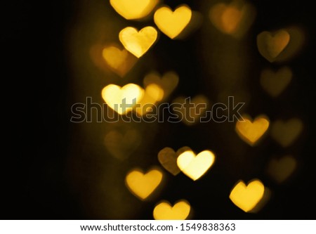 Festive overlay effect. Golden heart bokeh festive glitter background. Christmas, New Year and Valentine's day design.