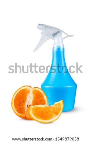 Orange against the background of a plastic bottle with a spray.