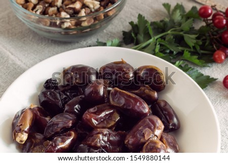 Healthy Breakfast: dried dates, walnuts, herbs. The concept of healthy eating.