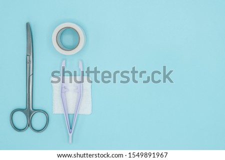 Flat lay of medical tools on light green background with copy space, medical and healthcare concept, Top view photo.