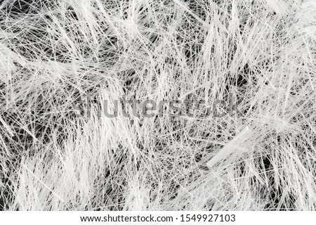 Top down, extreme close up of polypropylene multifilament micro fibers for concrete reinforcement. Construction macro background Royalty-Free Stock Photo #1549927103