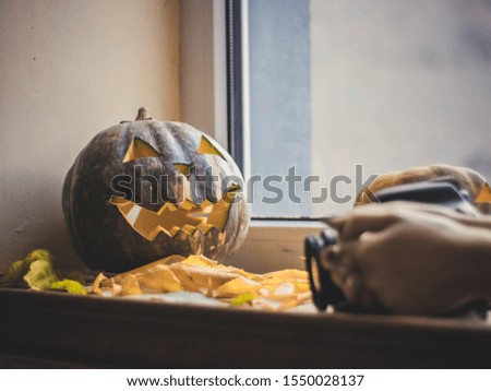 Pumpkins in leaves and candles for halloween