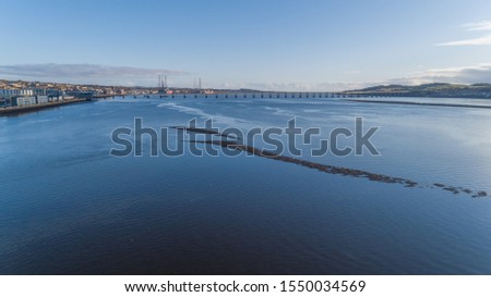 Aerial drone image of River Tay estuary at Dundee showing Dundee waterfront and Tay Road Bridge.