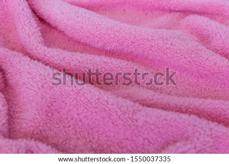 Bright texture fabric. Textile pink knitted cloth background.