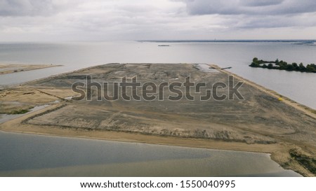 construction site by the Island of Ijburg during daylight shot with a drone from above