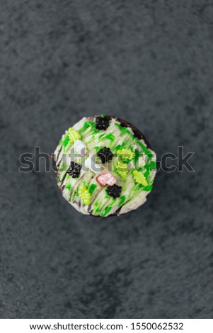Halloween chocolate cupcake with skeleton candy decoration