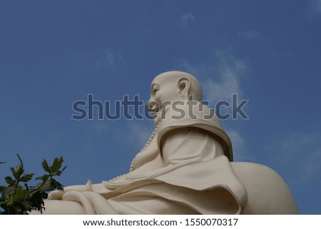 Blue Sky and Buddha in The Temple Pagoda, Ho Chi Minh City, Vietnam.