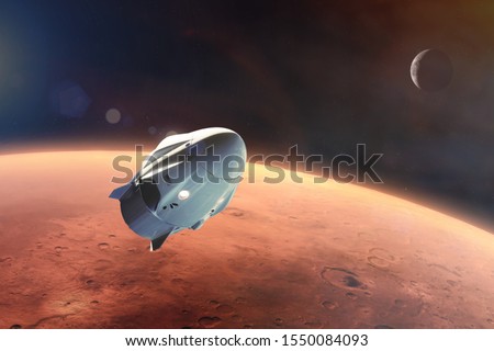 Cargo spacecraft in low-Mars orbit. Elements of this image furnished by NASA. Royalty-Free Stock Photo #1550084093
