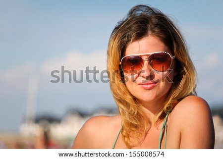Beautiful girl portrait outdoor enjoying  - Young woman fashion shoot by the sea portrait 