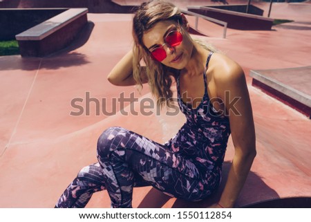 sports girl on the court resting