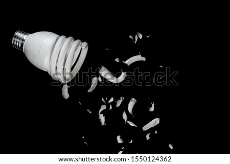 A broken white bulb On a black background
