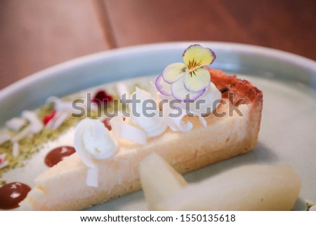 Food photography, cheesecake dessert plate in restaurant close up with detail