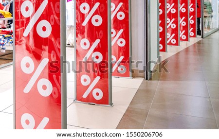 Discount on the banner on sale at the Mall at the entrance. Soft focus and blurred background