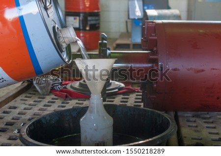 pouring chemical solvent to clean industrial electric motor rotor in geothermoelectric power plantplant Royalty-Free Stock Photo #1550218289