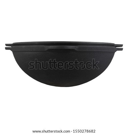 black empty cast iron wok isolated  on perfect white background, stock photography