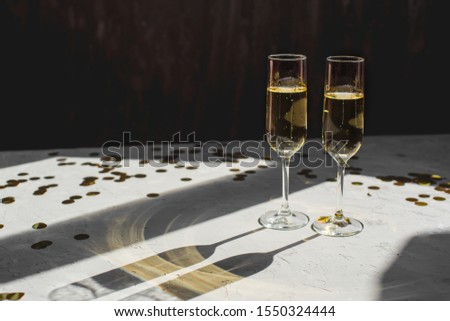 Two glasses of champagne as a symbol of New Year's celebration. Copyspace.