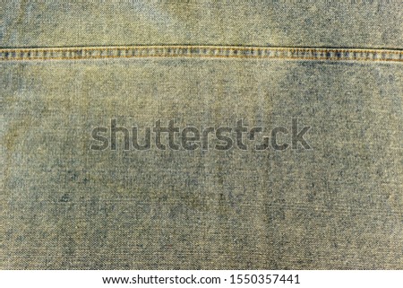 old faded frayed denim background texture
