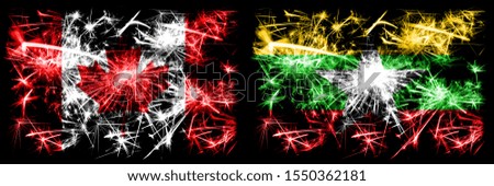 Canada, Canadian vs Myanmar New Year celebration sparkling fireworks flags concept background. Combination of two abstract states flags.
