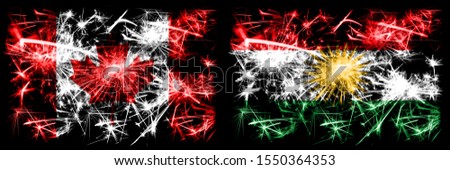 Canada, Canadian vs Kurdistan, Kurdish New Year celebration sparkling fireworks flags concept background. Combination of two abstract states flags.
