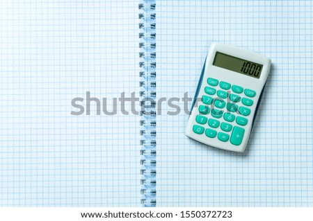 calculator on paper in the box, top view, empty space for text on the right, mock up