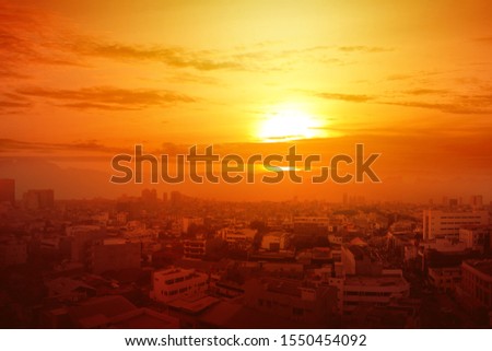 Heatwave on the city with the glowing sun background. Heatwave concept Royalty-Free Stock Photo #1550454092
