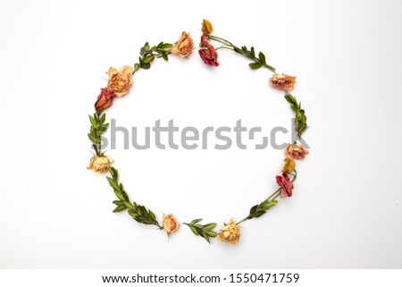 Dried flowers composition. Frame made of dried rose. Flat lay, top view Autumn floral pattern 