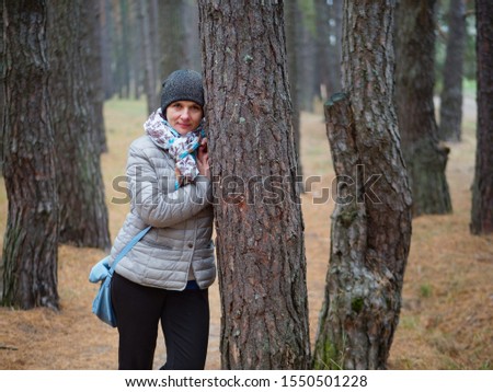 girl in a pine forest in autumn outdoors