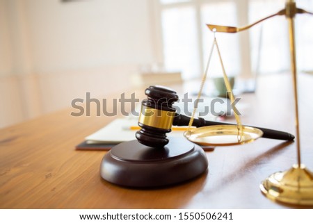 Justice law Scales and books and wooden gavel tool on desk in  Lawyer office.concept