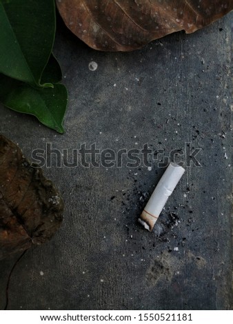 Cigarette butt on Concrete floor