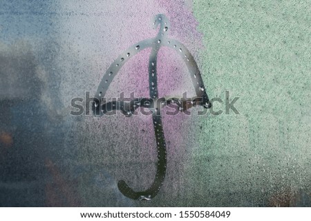 The inscription on the misted glass umbrella