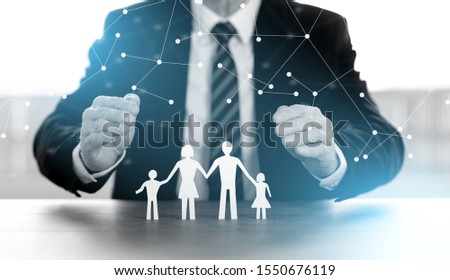 Insurer protecting family with his hands; multiple exposure
