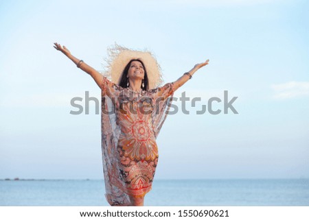 happy adult woman early morning on the beach