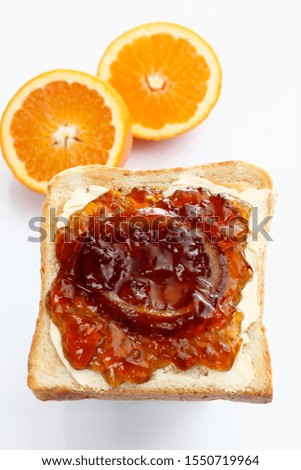 Slice of toast, toasted slice of bread, with homemade orange marmalade