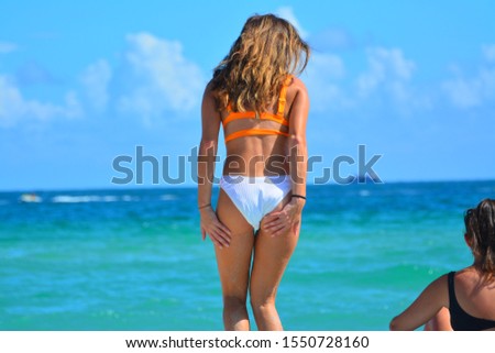 Beautiful Lady in Swimsuit in Tropical Beach
