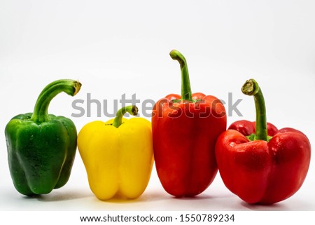 Fresh vegetables Three sweet Red, Orange, Yellow, Green Peppers isolated on white background