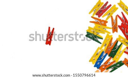 colored wooden clothes pegs on white background