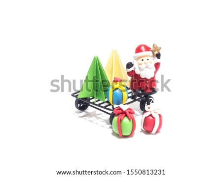 Christmas party, Santa sat on a cart with green and yellow origami Christmas tree and  gifts falling all waiting for the festival of happiness