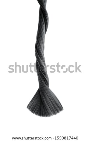 Black twisted hair on white background, isolated. Looks like animal tail. Carefully trimmed tips Royalty-Free Stock Photo #1550817440