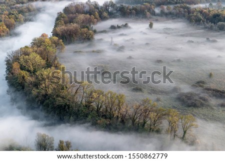 Foggy landscape over the river