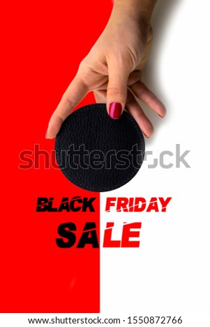 in woman hand motionless to blank template for black friday.Red and white background.Free space for logo and lettering plugin.